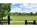 Scenic view of the lush backyard and neighborhood, seen from the balcony, offering a serene and peaceful setting at 608 Cielo Vista Dr, Greenwood, IN 46143