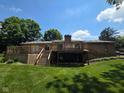 Expansive backyard featuring a wooden deck, perfect for outdoor entertaining and relaxation at 652 Spring Hills Dr, Zionsville, IN 46077