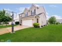 Lovely home with a basketball hoop, showcasing a well-kept lawn and exterior features at 73 Spring Lake Dr, Westfield, IN 46074