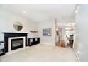 Bright living room with fireplace and ample space, complemented by neutral decor and hardwood floors at 73 Spring Lake Dr, Westfield, IN 46074