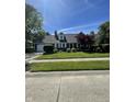 Beautiful home with lush green lawn and a well-maintained landscape at 8655 Chateaugay Dr, Indianapolis, IN 46217