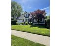 Beautiful home with lush green lawn and a well-maintained landscape at 8655 Chateaugay Dr, Indianapolis, IN 46217