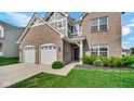 Lovely brick home featuring a well maintained lawn, two-car garage and inviting front entrance at 9717 Chuckwalla Pl, Fishers, IN 46040