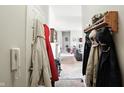 Bright hallway with a coat rack leading into the living area, offering a glimpse of the spacious layout at 17233 Gunther Blvd # 102B, Westfield, IN 46074