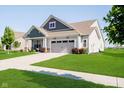 Well-maintained home with lush green lawn, showcasing the home's curb appeal on a sunny day at 19581 Sumrall Pl, Westfield, IN 46074
