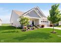 A cozy home featuring a well-kept lawn and landscaping, complemented by an attached two-car garage at 19581 Sumrall Pl, Westfield, IN 46074