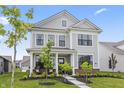 Beautiful two-story home featuring a cozy front porch and landscaped front yard at 2223 Ryder Pl, Westfield, IN 46074