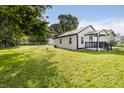 This single-story home boasts a spacious, well-maintained yard and a clean exterior at 2631 Collier St, Indianapolis, IN 46241