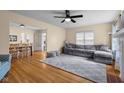 Spacious living room featuring hardwood floors, a comfortable sofa, and ample natural light at 2645 Washington St, Columbus, IN 47201