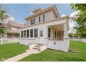 Inviting two-story home with a classic design and a welcoming front porch at 3035 N Capitol Ave, Indianapolis, IN 46208