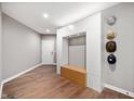 Stylish entryway with custom storage solutions and wood grain floors at 435 Virginia Ave # 101, Indianapolis, IN 46203