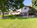 Large backyard with a well-maintained lawn and patio at 5730 Teresa Dr, Alexandria, IN 46001