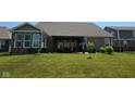 Large backyard with a patio and an elegant pergola-covered dining area at 6184 Farlin Dr, Whitestown, IN 46075