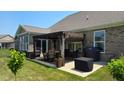 Cozy backyard patio area with a dining table, grill, and outdoor seating at 6184 Farlin Dr, Whitestown, IN 46075