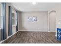 Bright living room features hardwood floors, natural light, and neutral paint at 6923 Bryant Pl, Plainfield, IN 46168