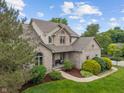 Beautiful aerial view of a two-story home showcasing its brick exterior and well-maintained landscaping at 7141 Ember Ct, Indianapolis, IN 46236