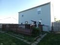 A spacious wooden deck is attached to the home and leads out into the lawn, perfect for outdoor entertainment at 8609 Wheatfield Dr, Camby, IN 46113