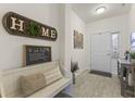 Inviting entryway featuring neutral tones and decorative accents, creating a warm and welcoming atmosphere at 998 Cherry Tree Ln, Greenwood, IN 46143