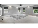 Spacious bedroom with neutral walls, plush carpeting, and four bright windows at 10722 Landsbrook N Run, Noblesville, IN 46060
