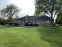Expansive backyard with a large deck, perfect for outdoor entertaining and relaxation at 12231 Valley View Cir, Indianapolis, IN 46229