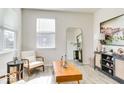 Bright living room with a large window, neutral decor, and stylish furniture at 1529 Fairmount Dr, Greenfield, IN 46140