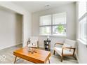 Cozy living room with natural light, comfortable seating, and minimalist decor at 1529 Fairmount Dr, Greenfield, IN 46140