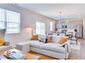 Open-concept living area with modern decor, flowing into the dining and kitchen spaces at 1529 Fairmount Dr, Greenfield, IN 46140