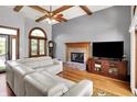 Bright living room with hardwood floors, fireplace, large windows, and comfortable seating at 1850 Longest Dr, Franklin, IN 46131