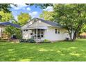 Well-maintained home with a lush lawn and charming curb appeal at 1868 N Hawthorne Ln, Indianapolis, IN 46218