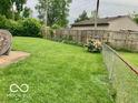 A lush backyard featuring green grass and a fence, perfect for outdoor activities at 1998 Crescent St, Franklin, IN 46131