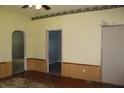 Inviting living room with wood floors, wainscoting and multiple entrances at 202 S Church St, Brooklyn, IN 46111
