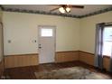 Bright living room with hardwood floors, natural light and exterior access at 202 S Church St, Brooklyn, IN 46111