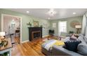 Living room with hardwood floors, a fireplace, and plenty of natural light at 2715 Northview Ave, Indianapolis, IN 46220