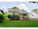 Single-story home with well-maintained lawn, established shrubbery, and inviting front porch at 3338 Orchard Ave, Indianapolis, IN 46218