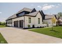 Beautiful home featuring attached three car garage and landscaped yard at 3713 Cherwell Dr, Zionsville, IN 46077