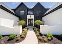 Charming exterior featuring a landscaped walkway leading to the front entrance at 3713 Cherwell Dr, Zionsville, IN 46077