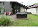 Backyard deck with a covered hot tub, greenery, and an inviting outdoor space at 4029 Gamay Ln, Indianapolis, IN 46254
