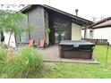 Backyard deck with a hot tub, seating, and open views, perfect for relaxation at 4029 Gamay Ln, Indianapolis, IN 46254