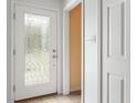 Bright entryway features tile floors and a front door with decorative glass at 4904 N Tillotson Ave, Muncie, IN 47304