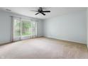 Living room offers great natural light from the large picture window at 4904 N Tillotson Ave, Muncie, IN 47304