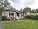 Single story house with black awning and large front window at 5348 Crittenden Ave, Indianapolis, IN 46220