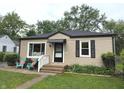 Charming single-story home with a black awning over the front door at 5348 Crittenden Ave, Indianapolis, IN 46220