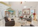 Cozy living room with tile floors, neutral paint colors, comfortable furnishings, and lots of natural light at 6627 Cobden Ct, Indianapolis, IN 46254