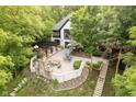 Gorgeous aerial shot of a home with an outdoor patio, pergola, and beautiful landscaping at 8301 Reef Ct, Indianapolis, IN 46236
