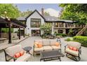 Inviting backyard patio with comfortable seating, outdoor dining area, and manicured landscaping at 8301 Reef Ct, Indianapolis, IN 46236