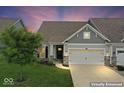 Charming home exterior with a well-manicured lawn and a two-car garage at 104 Perlican Dr, Cicero, IN 46034