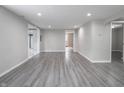 Spacious basement featuring durable gray flooring and neutral walls at 1141 Temperance Ave, Indianapolis, IN 46203