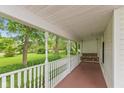 Inviting front porch with a classic swing, perfect for relaxing and enjoying the outdoor scenery at 126 N Darlington St, Jamestown, IN 46147