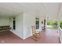 Cozy porch with a rocking chair, offering a relaxing space to enjoy the outdoor view at 126 N Darlington St, Jamestown, IN 46147
