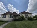 Spacious home boasts professionally landscaped yard, green shutters, brick walkway, and large green lawn at 1809 Milford St, Carmel, IN 46032